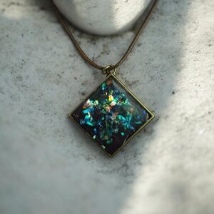 Elegant Bronze Adjustable Pendant Necklace With Holographic Accents
